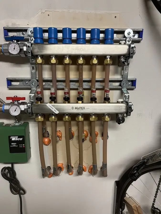 Plumber performing Water Heater Repair at a residential property in Ramsey